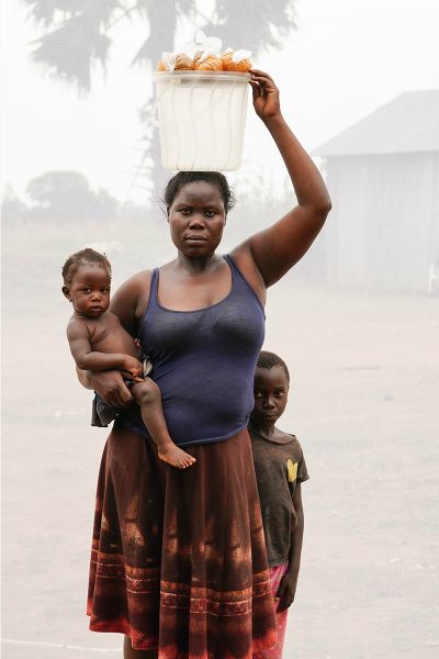 Ocwee Pamala: Age 30 with her daughter and son selling G-nut pasteDan NelkenNew York, New York