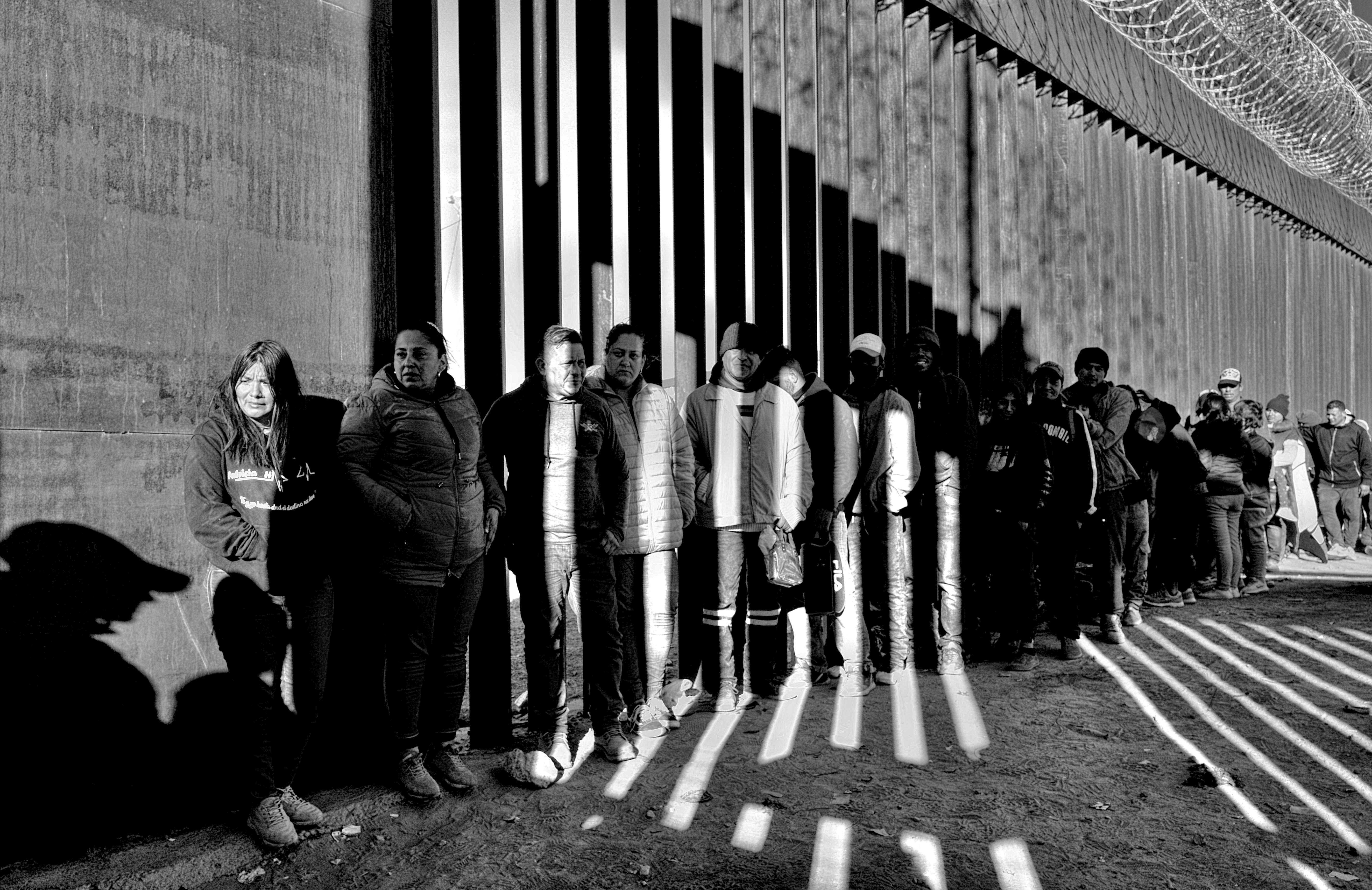 Asylum Seekers Lined up at the Border Wall, El Paso, TX 2022