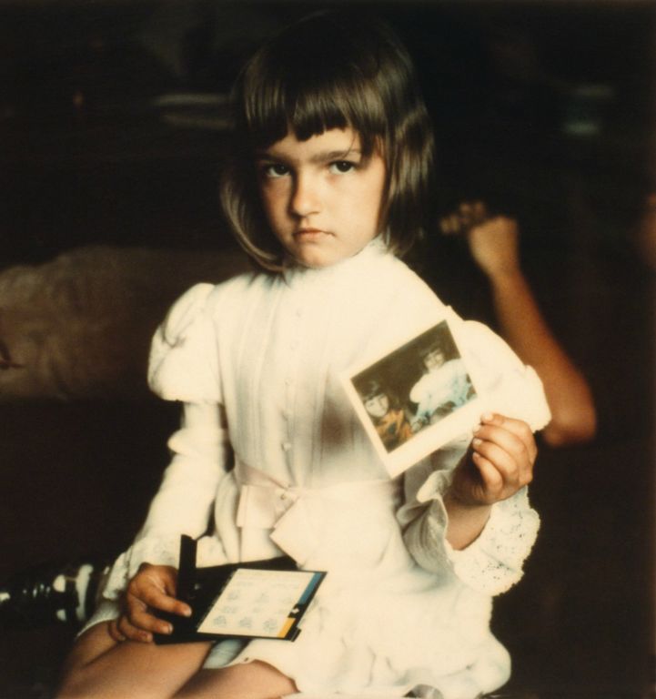 Little Girl Holding Her ImagePolaroid Time-Zero Film. Archival Digital PrintByron RogersSan Angelo, TX